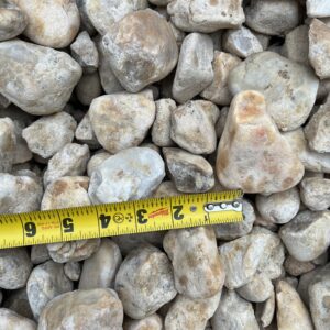 stones ranging from greys to oranges and some brown, sizes varying between around an inch to multiple inches