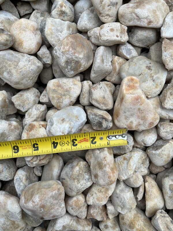 stones ranging from greys to oranges and some brown, sizes varying between around an inch to multiple inches