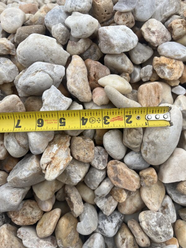 stone varying from greys to oranges and some brown, sizes ranging from around an inch to multiple inches