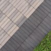 greyish tan thin pavers surrounded by two columans of darker grey ones
