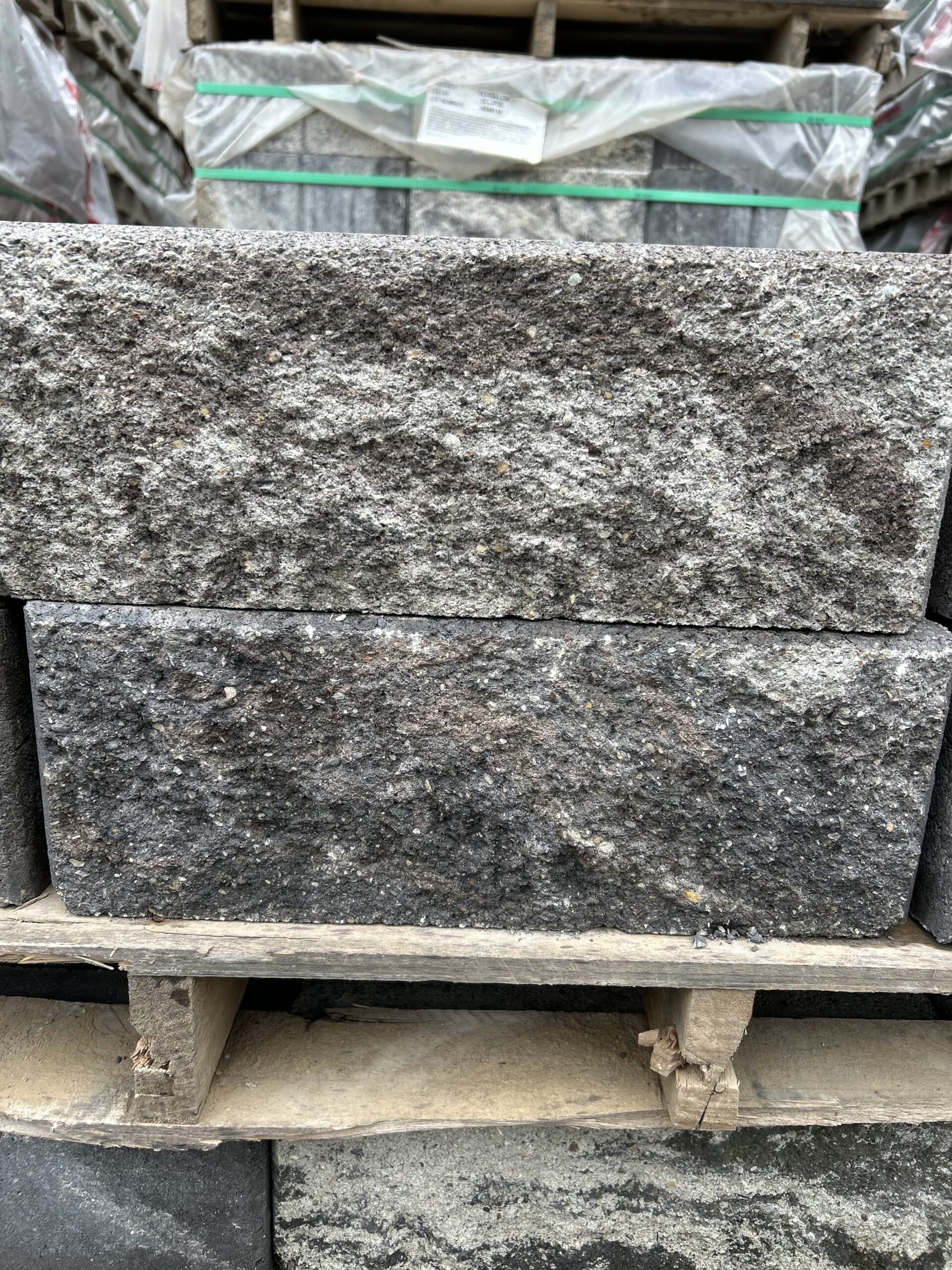 Rough rectangular blocks in greys and browns