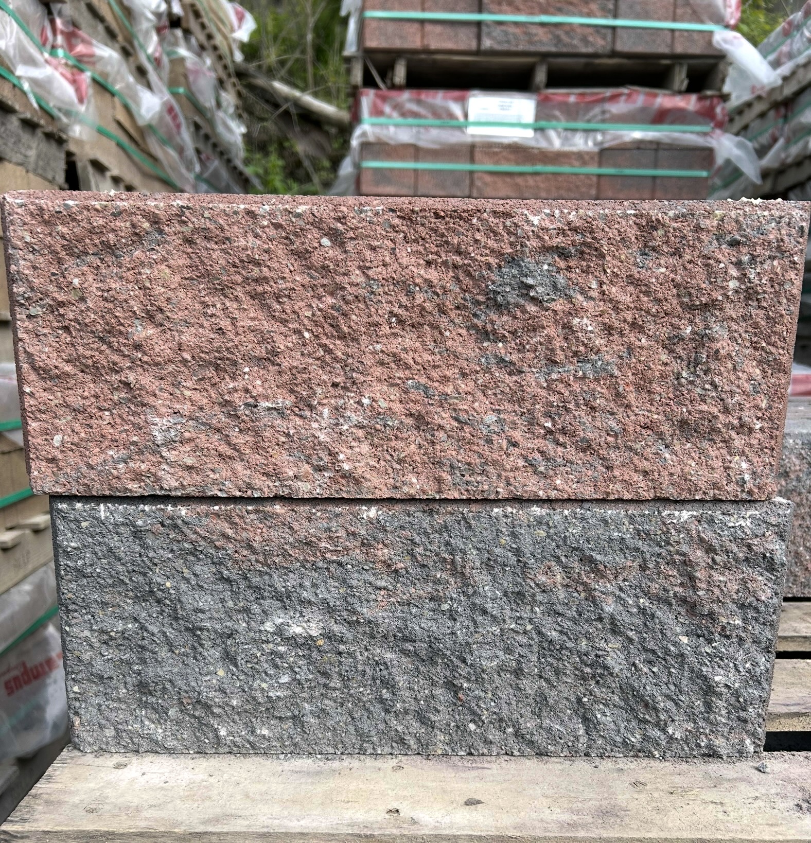 pinkish red and grey rectangular stone block