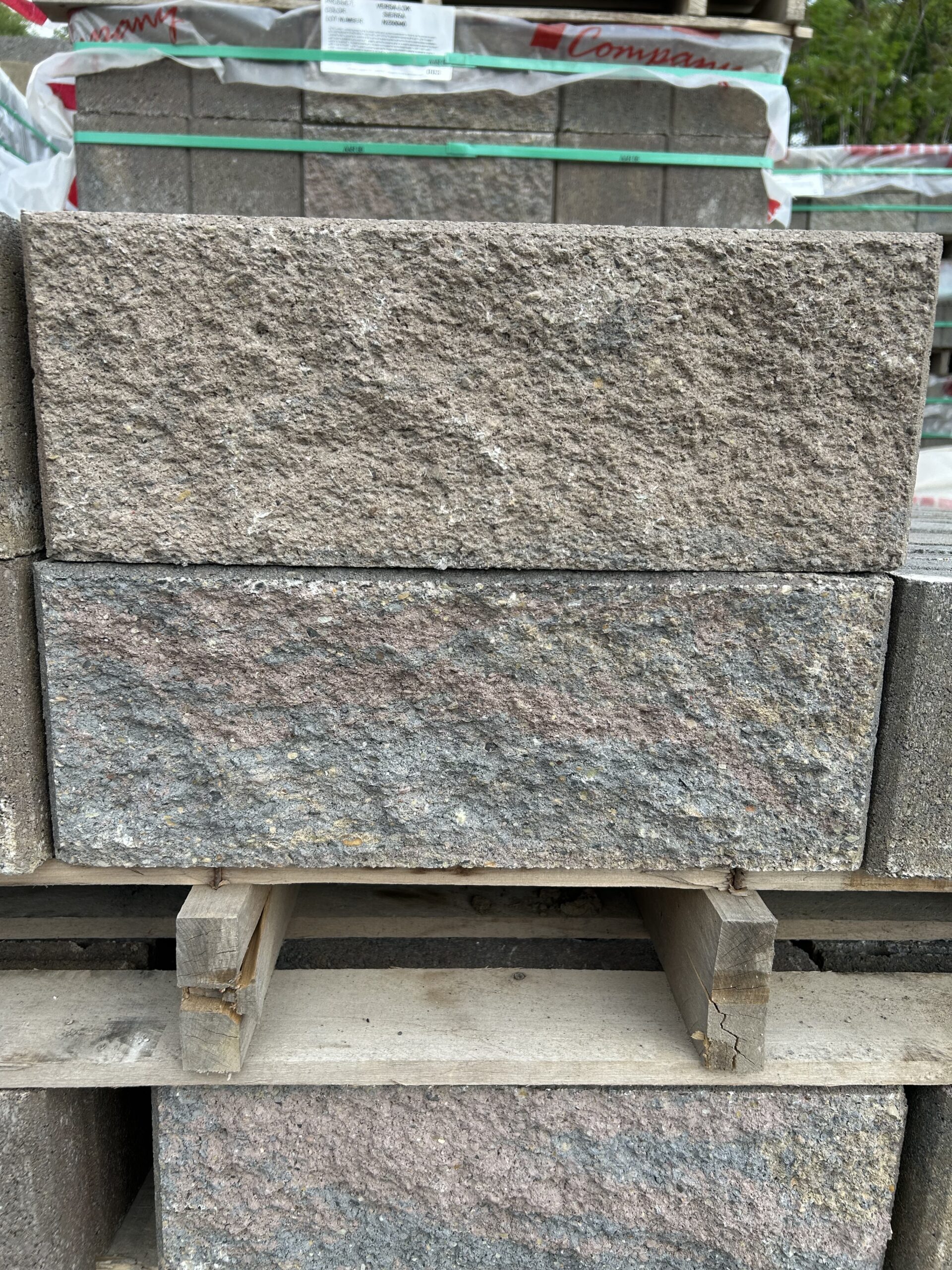 Tan, light pink and grey rectangular stone block